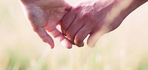 Couple holding hands.
