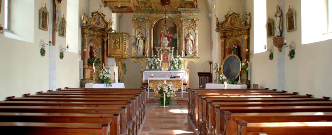 Inside of a catholic church during a funeral.