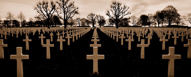 rows of crosses at a cemetery