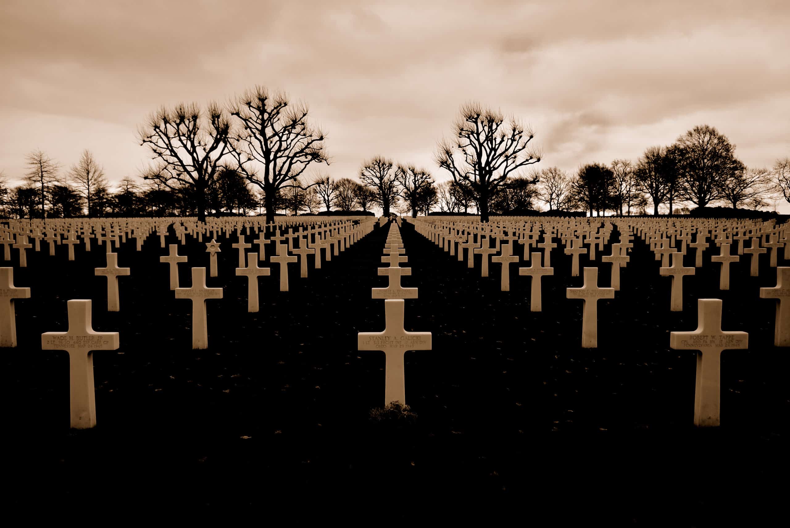 rows of crosses at a cemetery