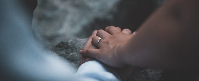 married couple holding hands