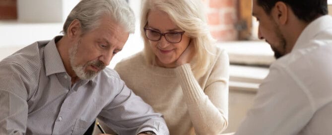 Couple signs document - what is cremation preplanning?