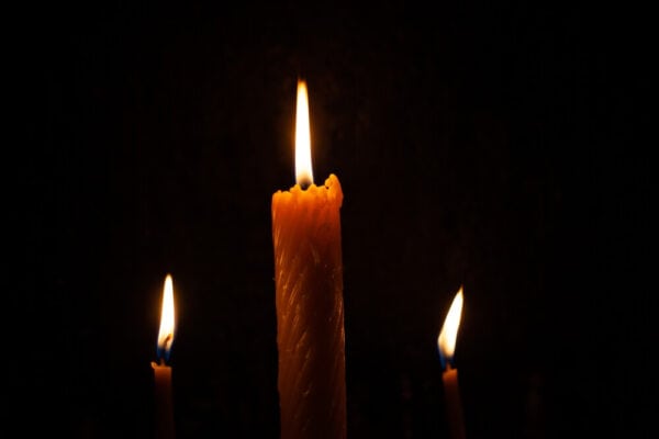 Candles burn at funeral services.