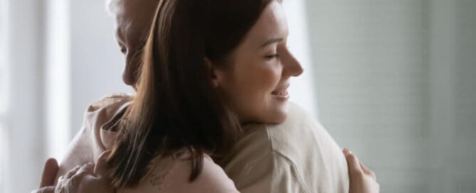 Family members comfort one another at a personalized celebration of life service.